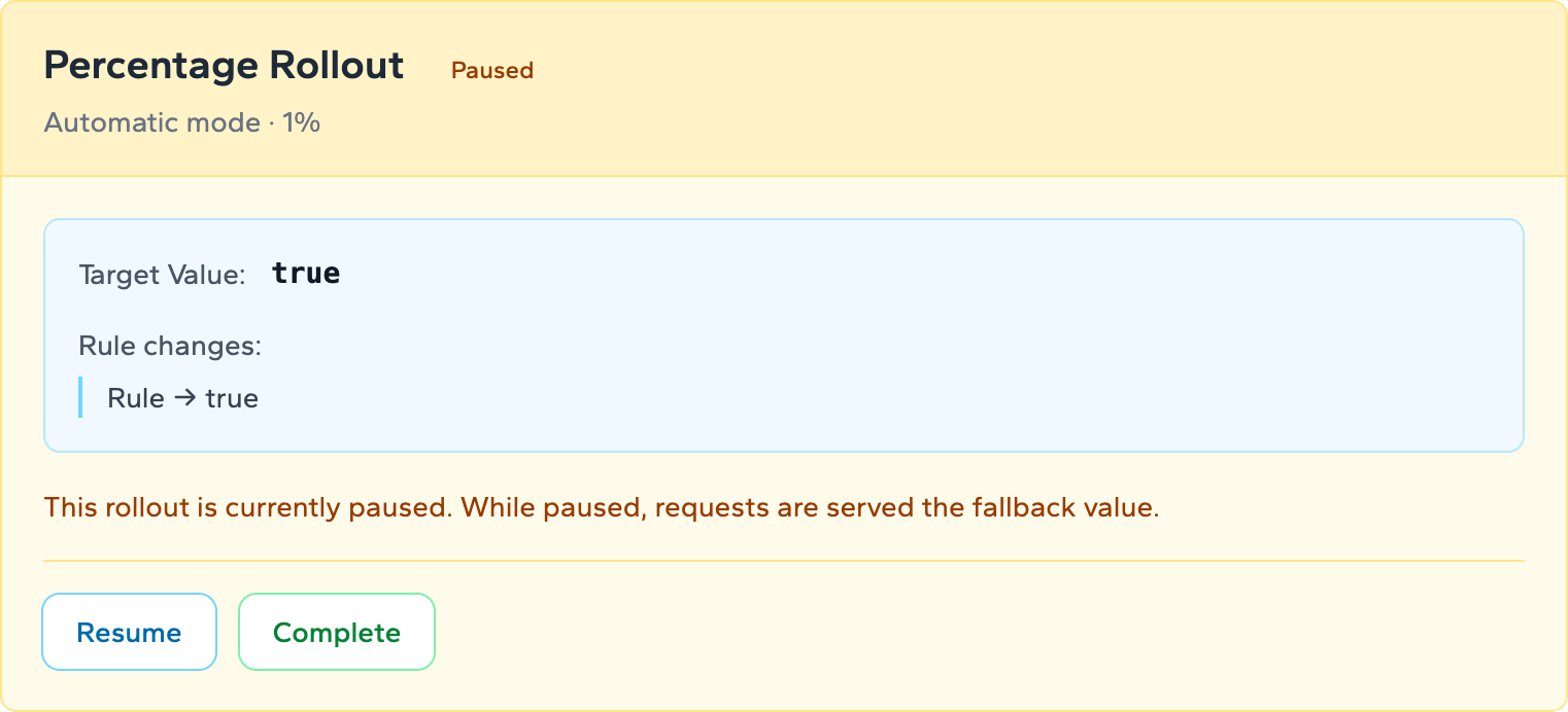 Paused rollout panel with amber background and the message that requests are served the fallback value while paused